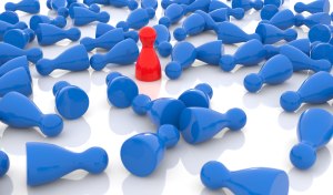 red pawn standing among a crowd of blue pawns
